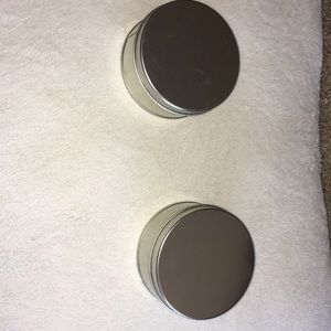2 round metal tins
